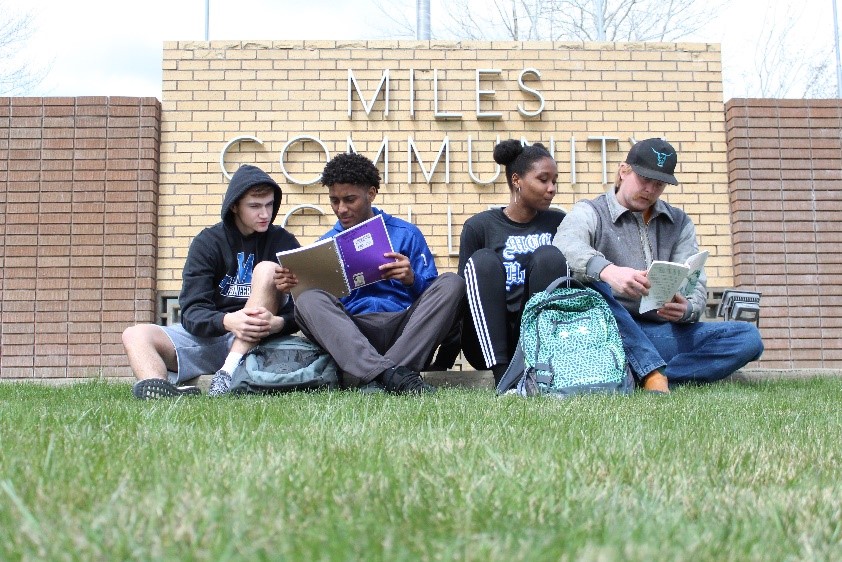 Image of four students studying