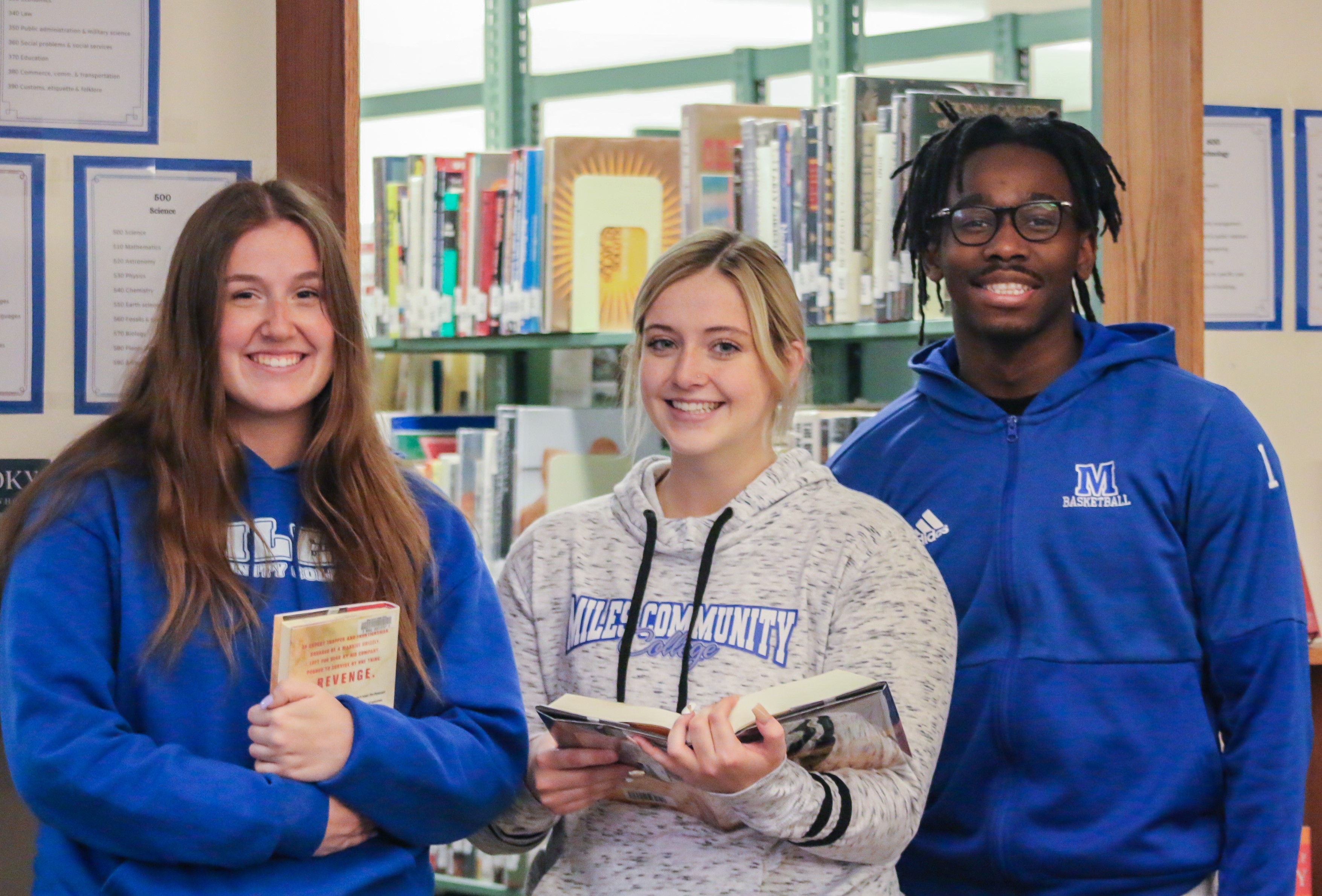 Image of students standing in library